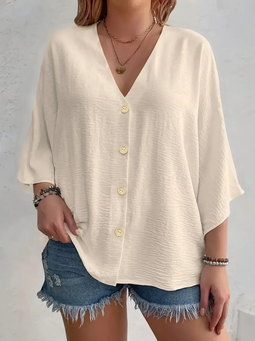 Noora | Signe – Blus med knäppning och ¾-ärm